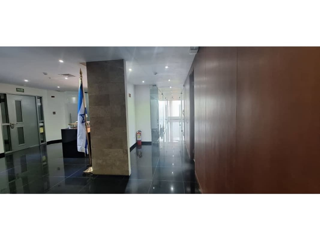 Bright office space with large window offering Panama City skyline view at Ocean Business Plaza