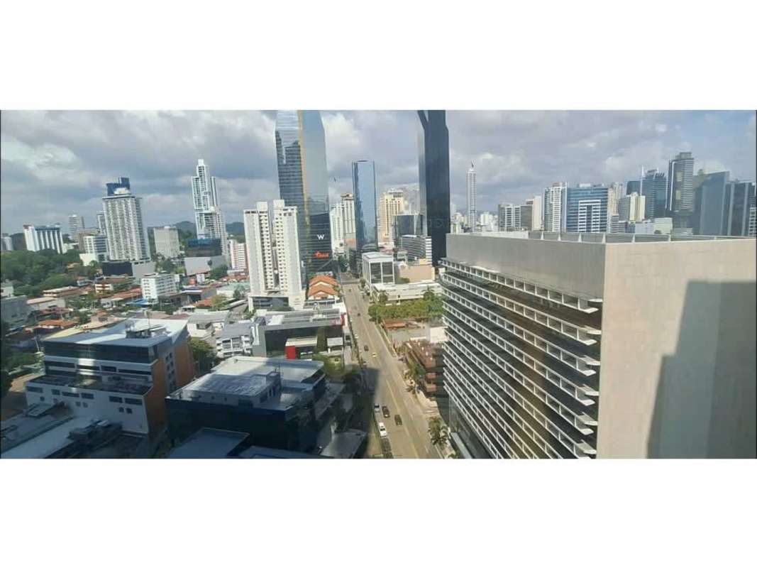 Modern furnished waiting room with blue sofas and glass walls at office in Torre Banesco Panama