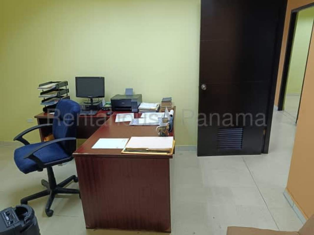 Professional office space with large desk bookshelf and certificates in Rio Abajo Panama