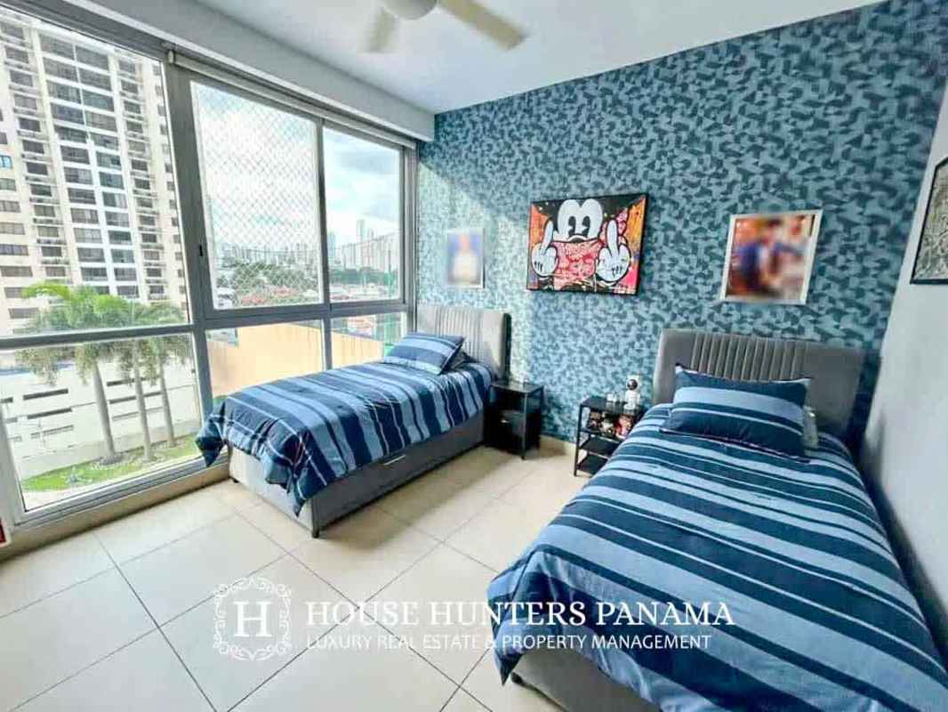 Modern living room with balcony access, city and ocean views at PH Dupont in Punta Pacifica Panama