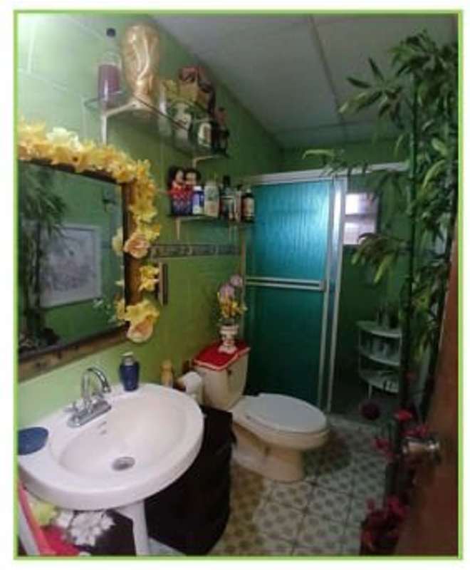 Outdoor laundry area mosaic tile flooring utility space Juan Díaz Panama