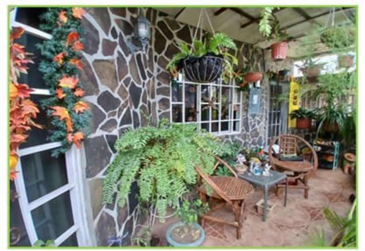 Eclectic bathroom with green walls pedestal sink glass shower enclosure Juan Díaz Panama house for sale