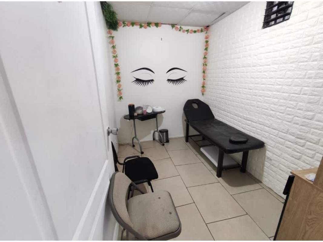Private treatment room with wall art and bed in beauty salon for sale Panama