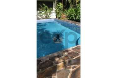 Rustic house porch large garden lawn tropical plants country estate El Valle Panama