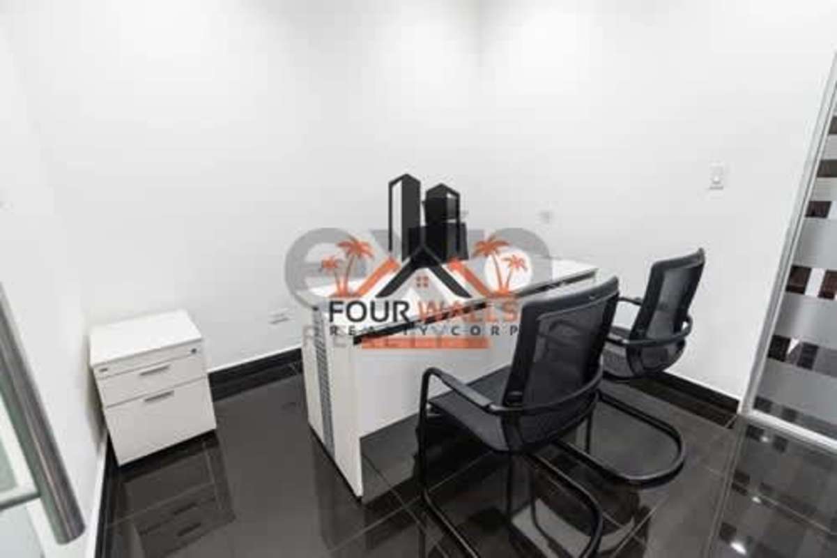 Reception area with modern seating, desk, and decorative finishes at PH Office One Obarrio Panama