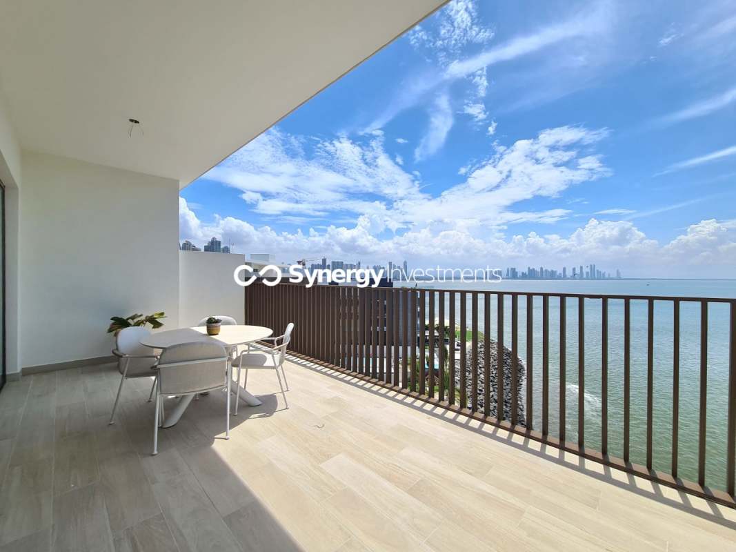 Modern kitchen with marble countertops island open layout luxury penthouse at Ocean Reef Islands Panama