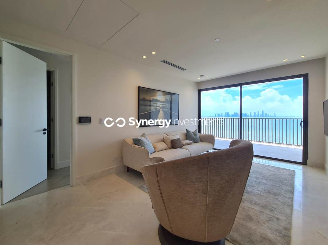 Spacious master bedroom with floor-to-ceiling windows ocean view walk-in closet Ocean Reef Islands Panama