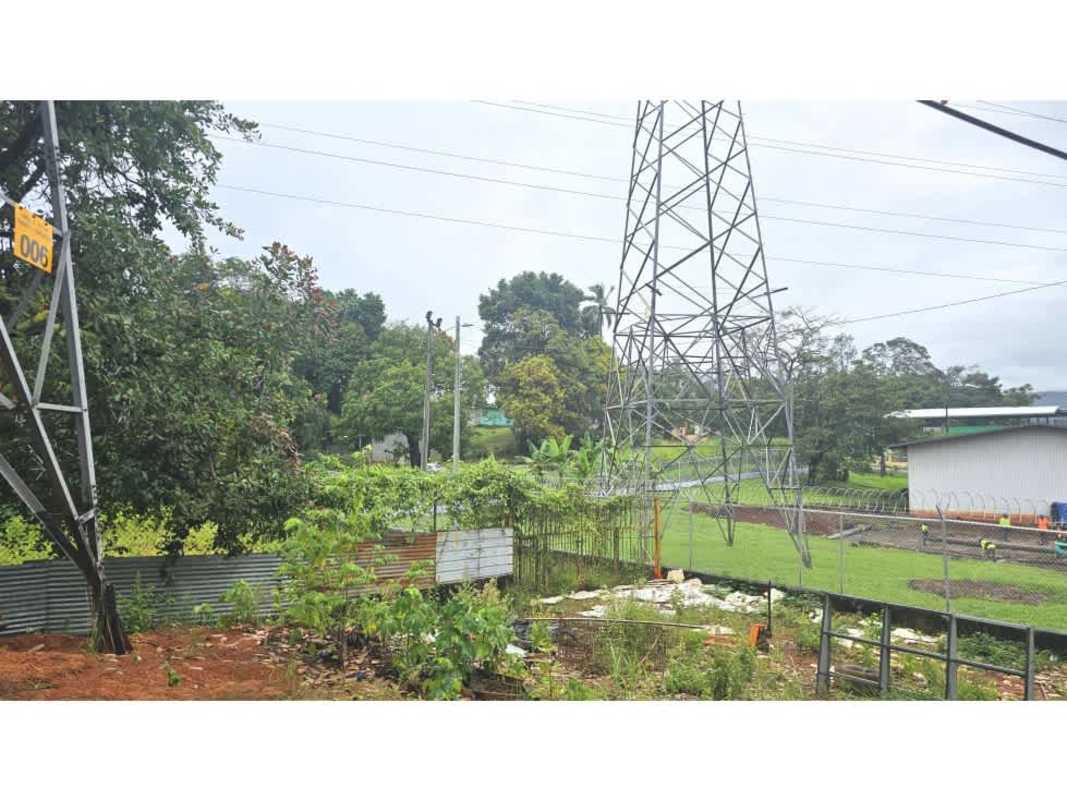 Barbed wire fence, workshop area and utilities on industrial lot in Villalobos Pedregal Panama City