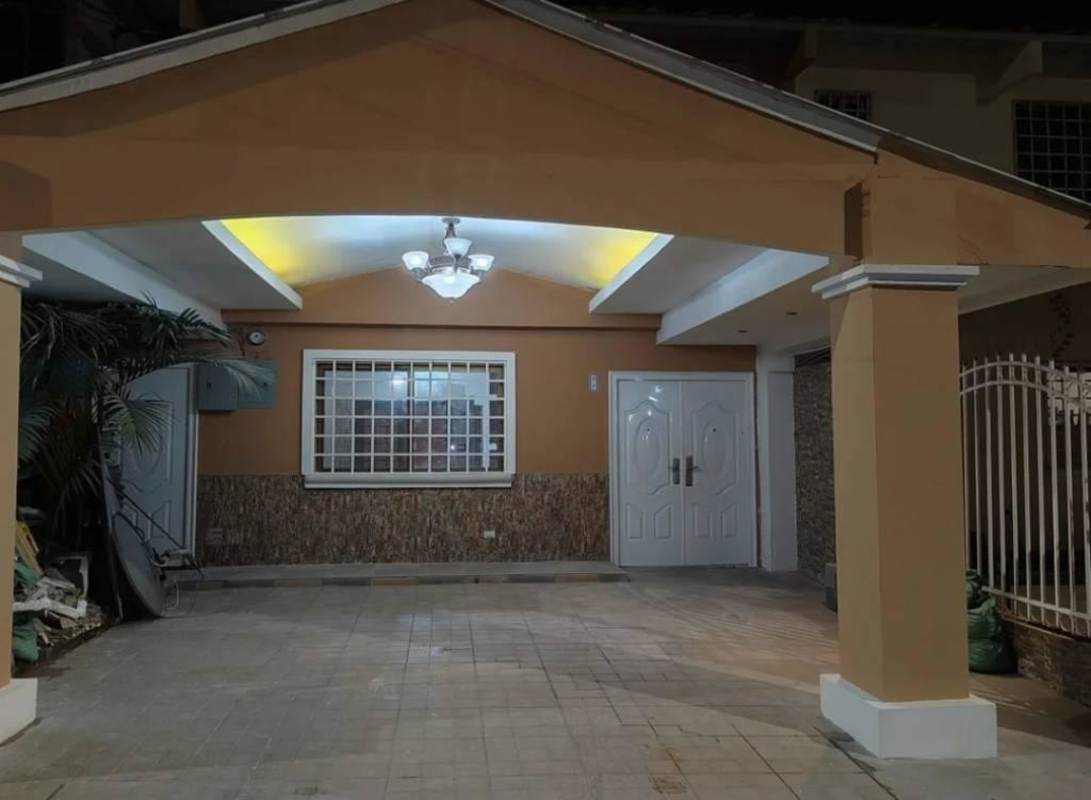 Exterior of two-story duplex with double doors, porch, and gate Cerro Viento Panama