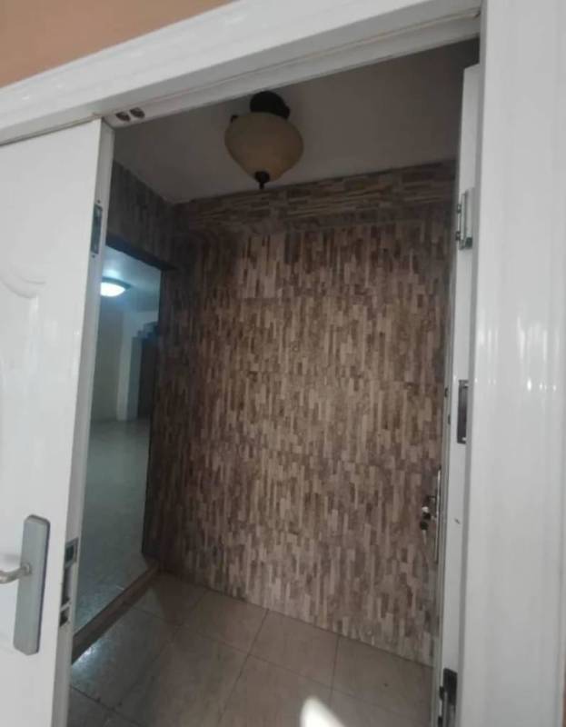 Entrance hallway with sliding double doors and tiled feature wall Cerro Viento Panama