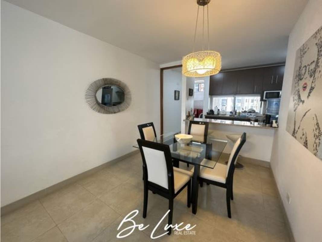 Modern dining with glass table and open kitchen overlooking ocean PH Terrasol San Francisco