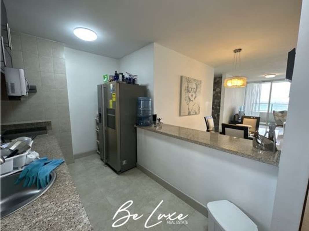 Fully equipped kitchen with granite countertops and wood cabinets in PH Terrasol San Francisco