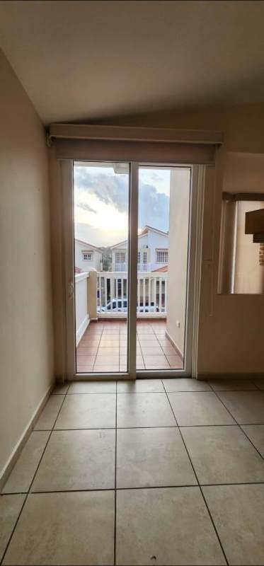 Interior room with sliding doors to balcony and tile floors at PH Brisas Heights Brisas del Golf Panama