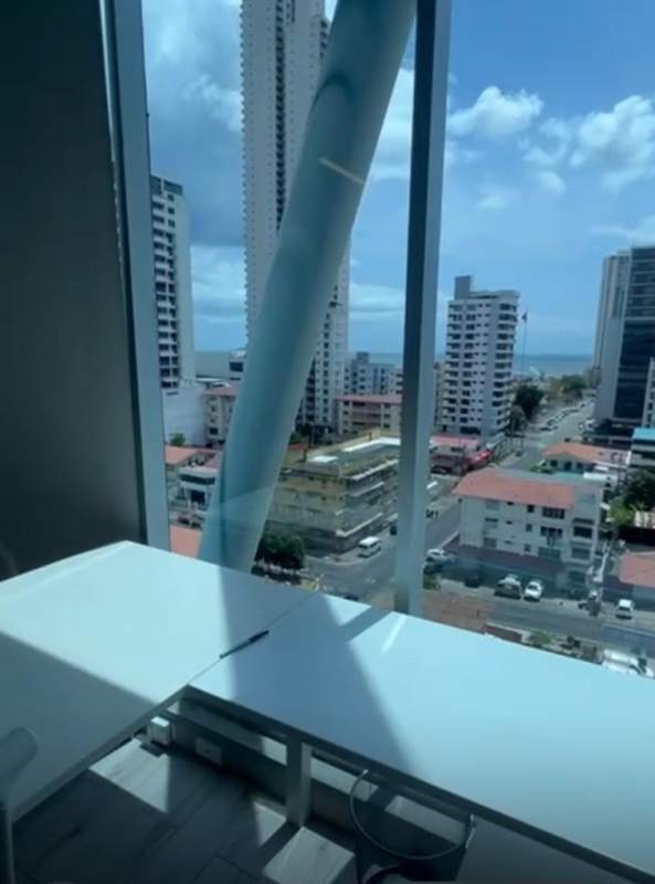 Commercial office bathroom with gray tile fixtures PH Office 77 San Francisco Panama