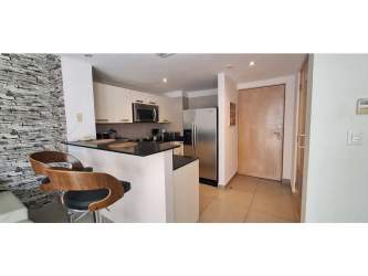 Fully equipped kitchen with granite countertops and appliances at PH Mosaic