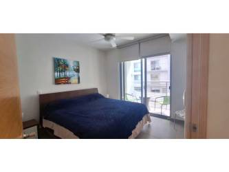 Spacious bedroom with balcony access fully furnished at PH Mosaic Panama Pacifico