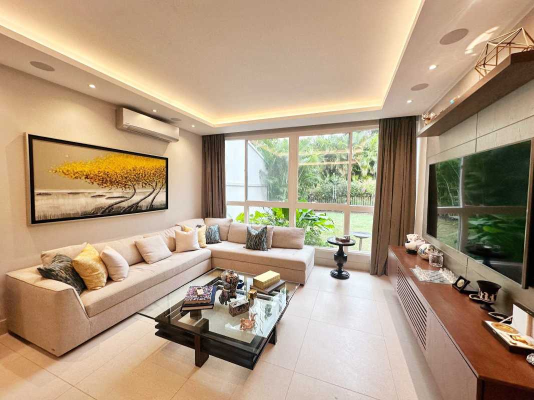 Contemporary dining room with glass table, recessed lights, mirrors at The Grove Santa María Golf Club Panama