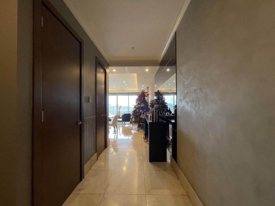 Marble floor hallway leading to modern living dining area at The Reserve Santa Maria Panama