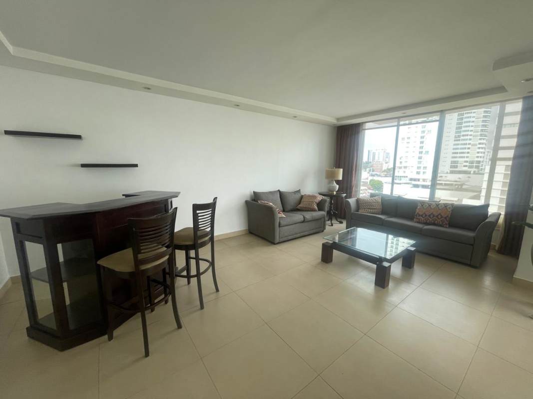 Kitchen with granite counters, wooden cabinets, breakfast bar, appliances in PH 7400 East Tower San Francisco Panama