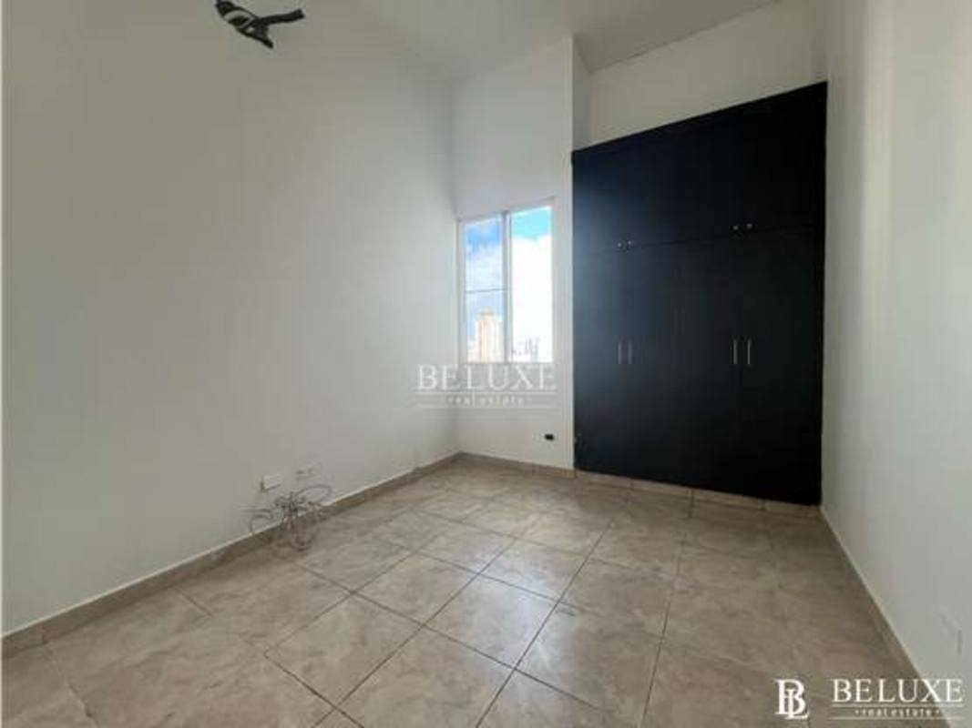 Bedroom with large window tiled floor and built-in wardrobe PH Kubic Panama City