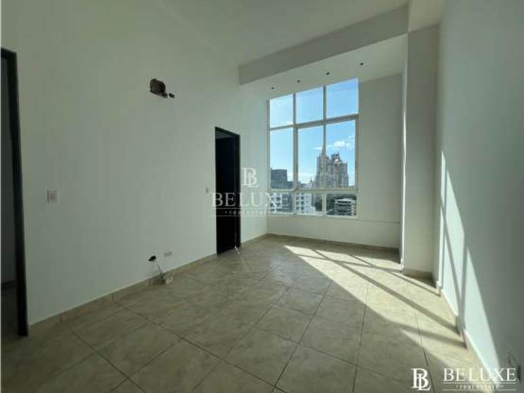 Open plan apartment living space with floor-to-ceiling windows ceramic floors PH Kubic El Cangrejo Panama