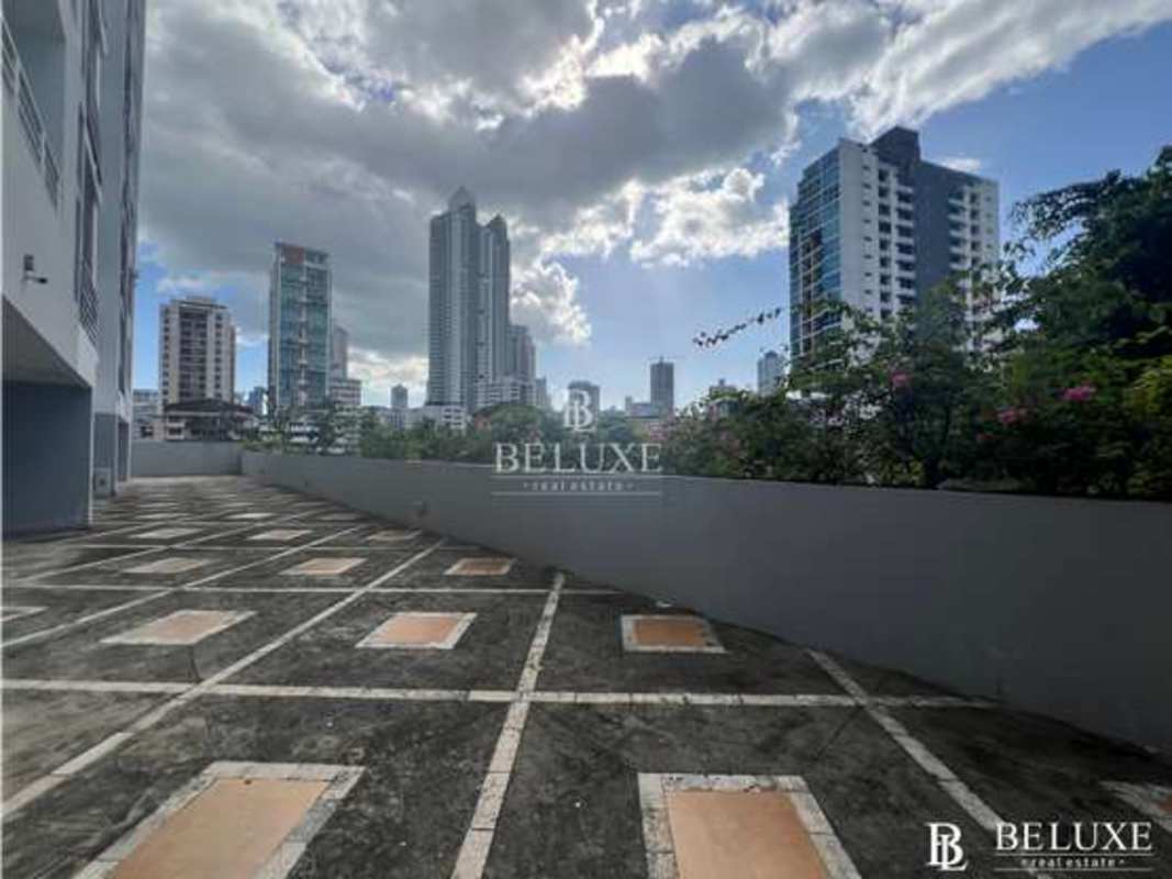 Open parking area with city skyline backdrop PH Kubic El Cangrejo Panama