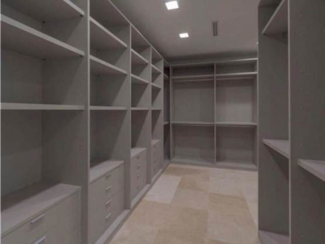 Expansive terrace with lounge and dining area overlooking gardens and golf in The Reserve Santa Maria Panama