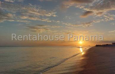 Ocean beachfront view with palm trees from terrace at Punta Chame Beach Residences