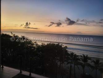 Bright living area opens to ocean-view balcony at Punta Chame Beach condo Panama