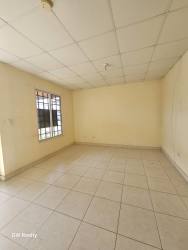 Modern bathroom with walk-in shower, vanity, wall mirror, tiled finish in Costa Verde La Chorrera