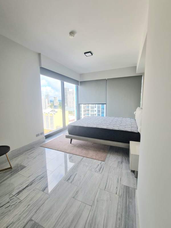 Bedroom with large windows and spectacular ocean view at PH Nuovo by Armani Casa Panama City