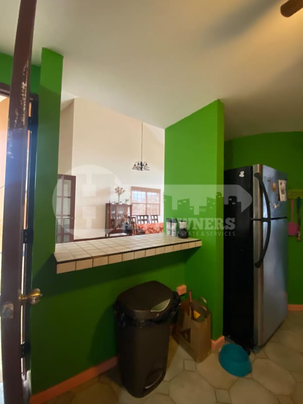 Sunroom enclosed patio with hammocks garden view La Montañesa Club de Golf Panama house