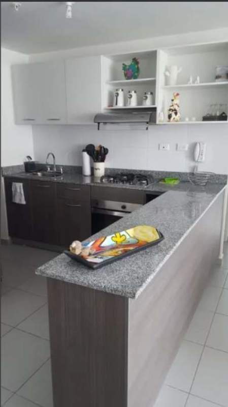 Compact kitchen with granite countertops plus laundry area PH Aviñón Tower San Miguelito Panama