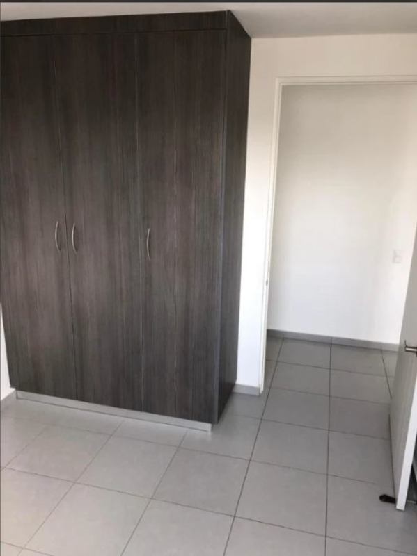 Master bedroom with ensuite bath and walk-in closet in PH Aviñón Tower San Miguelito Panama