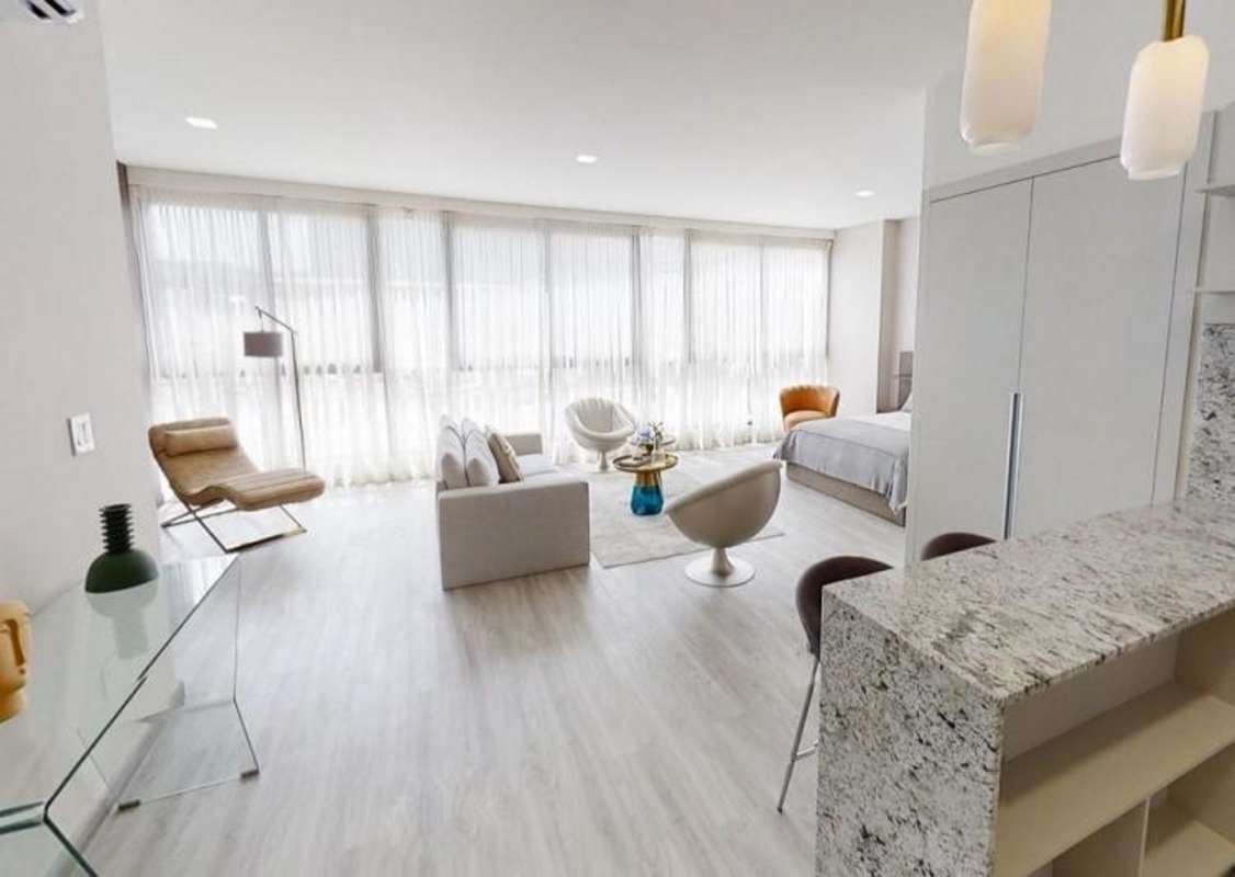 Studio bedroom with floor to ceiling windows city views PH Arcadia Costa del Este Panama