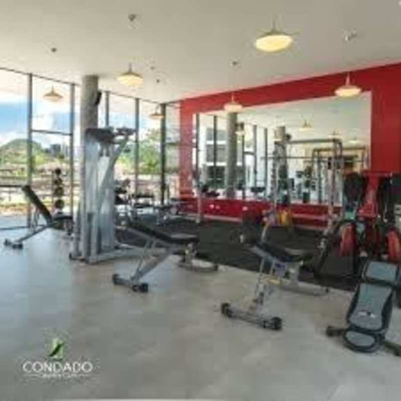 Modern high-rise towers and pool with palm trees in Condado del Rey Panama City