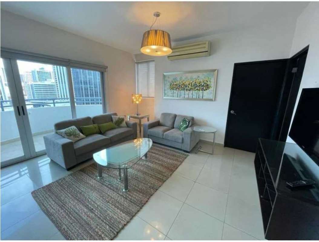 Dining space with balcony access city views PH Galería Uno apartment Obarrio Panama