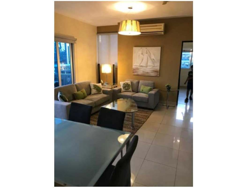 Outdoor swimming pool lounge area with skyline views at PH Galería Uno Obarrio Panama City