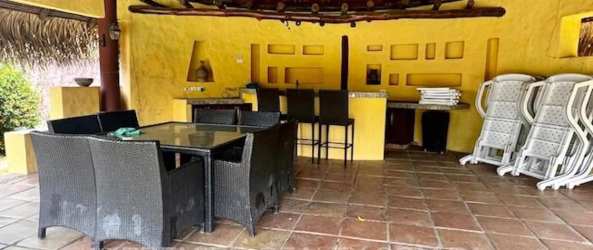 Swimming pool with jacuzzi, palapa hut, tropical plants in luxury villa Coronado Panama