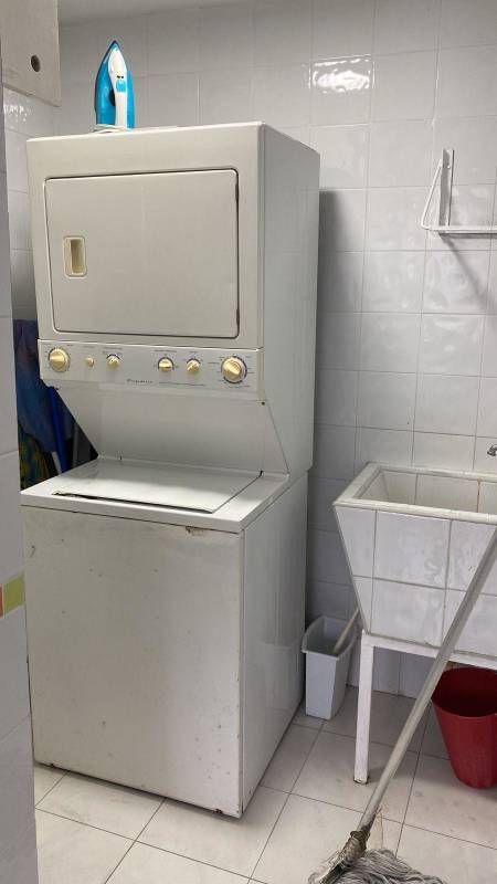 Contemporary living dining space gray sofas glass table accent wall PH Plaza Paitilla Panama