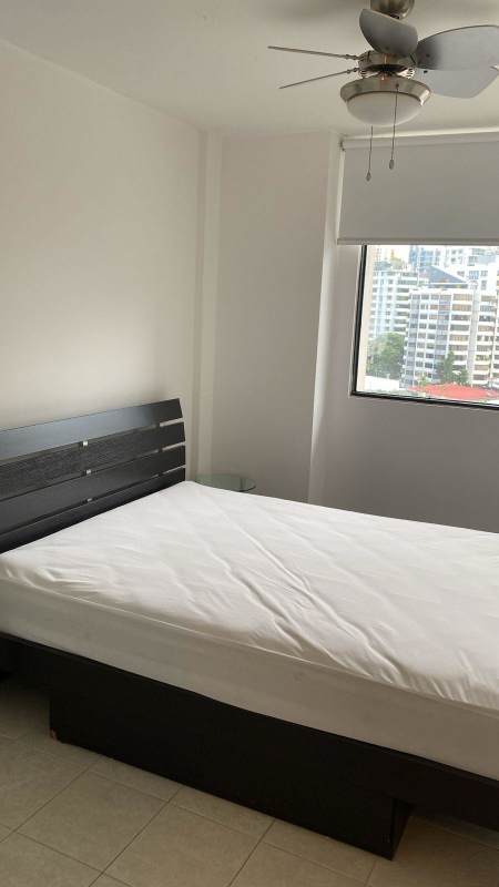 Contemporary kitchen white cabinets black countertops stainless appliances PH Plaza Paitilla Punta Paitilla