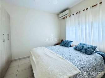 Bright master bedroom with ocean views and en-suite bathroom at PH Gatún Bijao Panama beachfront apartment