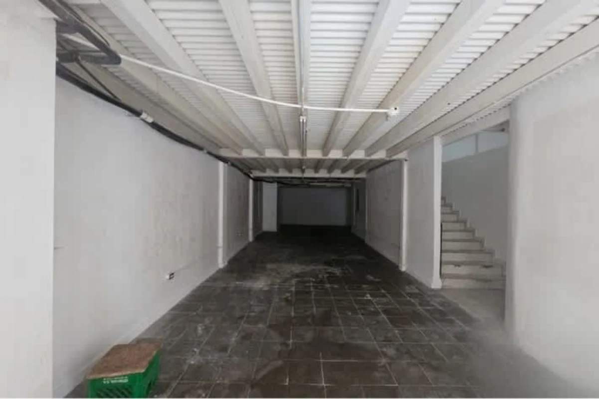 Commercial property basement with tile flooring exposed beams and stairs access Casco Viejo Panama