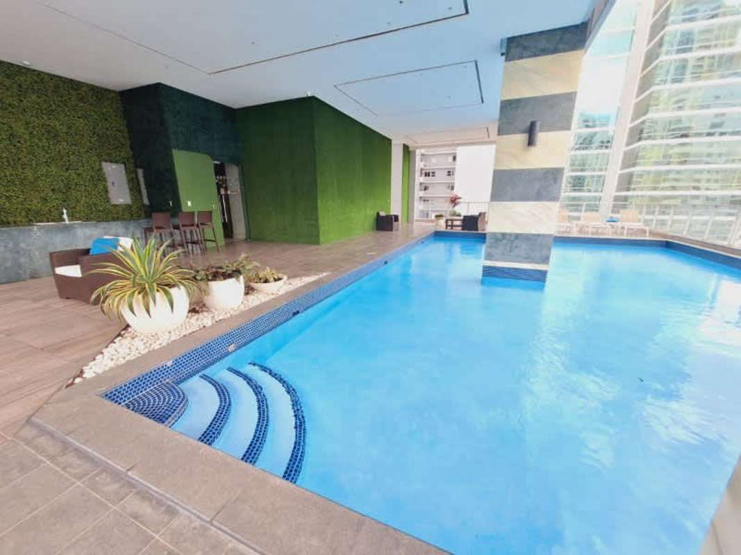 Bright living dining open layout floor-to-ceiling windows panoramic skyline views PH Jade San Francisco Panama