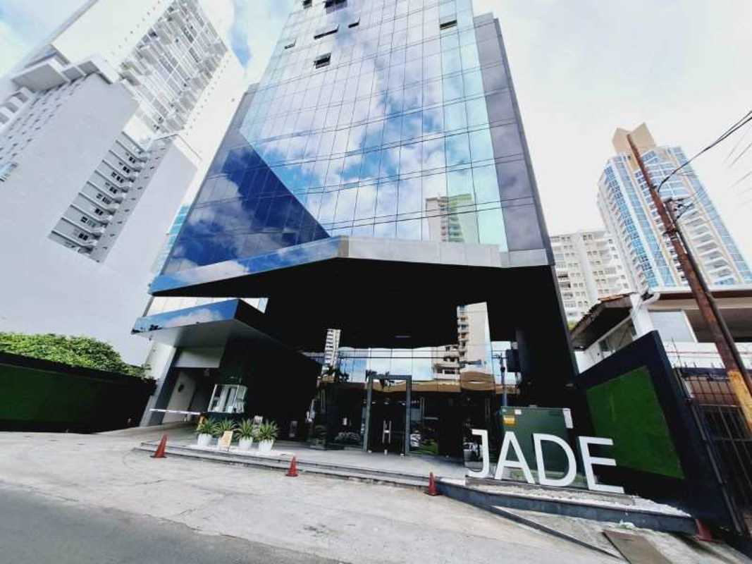 Luxury indoor swimming pool panoramic windows lounge seating skyline view PH Jade San Francisco Panama