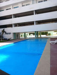 Bright living room with sliding doors to balcony and ocean view in Coronado Bay tower Panama