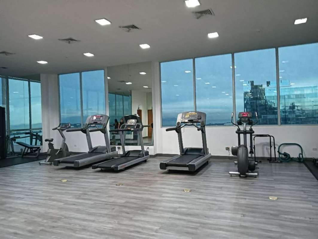 Private balcony overlooking ocean and city skyline in luxury PH BICSA apartment Avenida Balboa Panama City