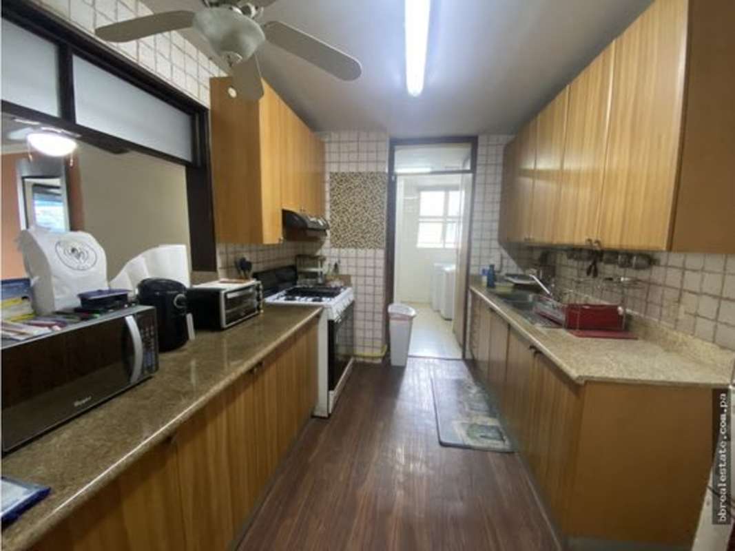 Small bathroom with wall sink, mirror cabinet, shower curtain PH Sunrise Tower Obarrio