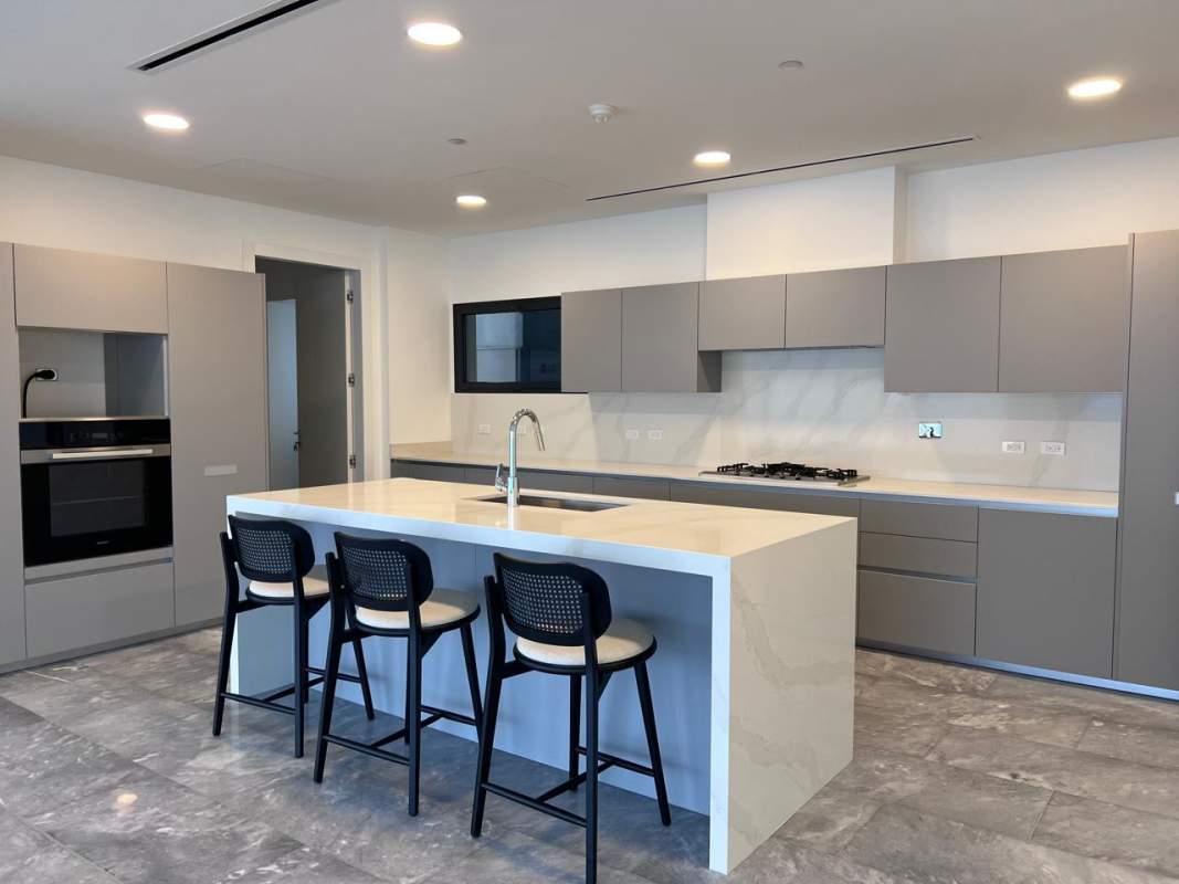 Modern empty living room with marble floors, panoramic windows in PH Upper East Costa del Este