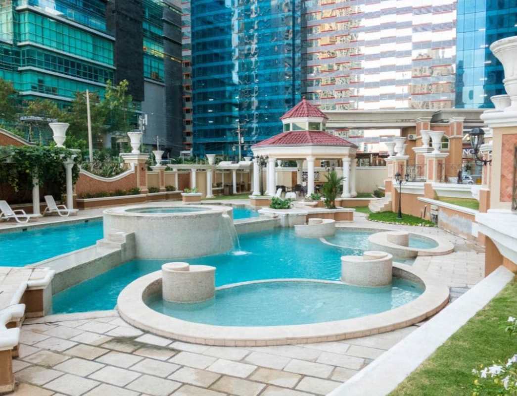 Luxury twin tower high-rises with pool, gazebo, lush landscaping at Mystic Point Panama City